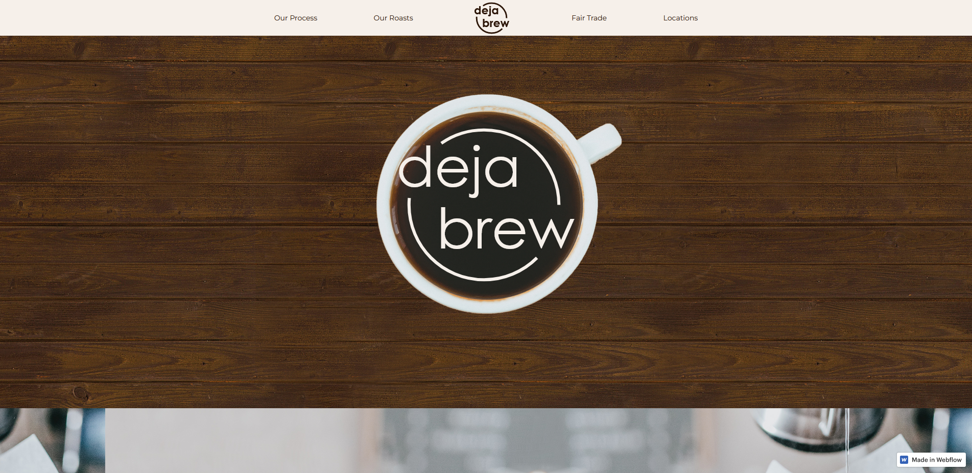 A screenshot of a fictitious coffee shop website featuring a coffee mug on a wooden table that is branded as Deja Brew.